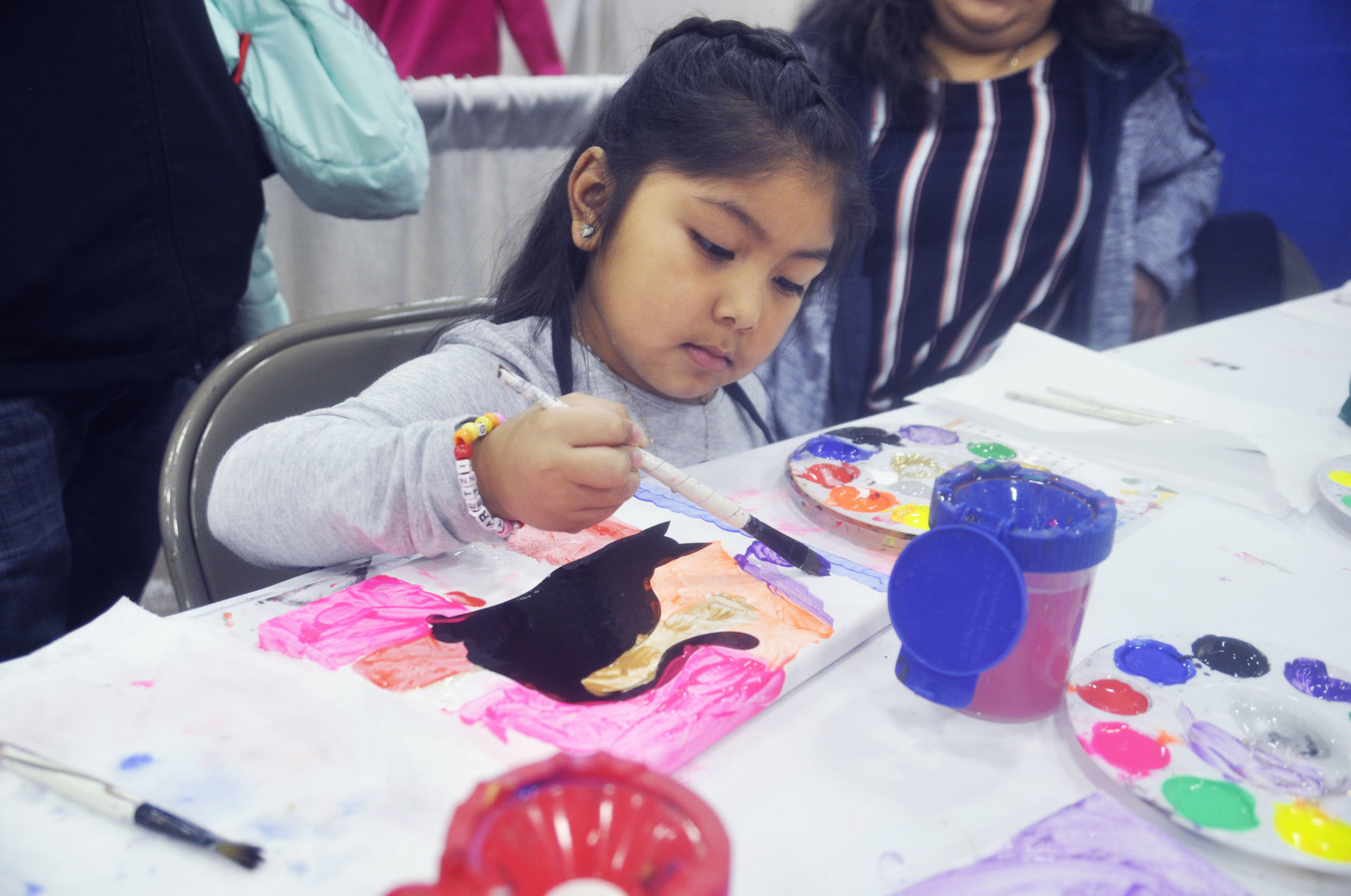 Kids Expo - girl painting picture
